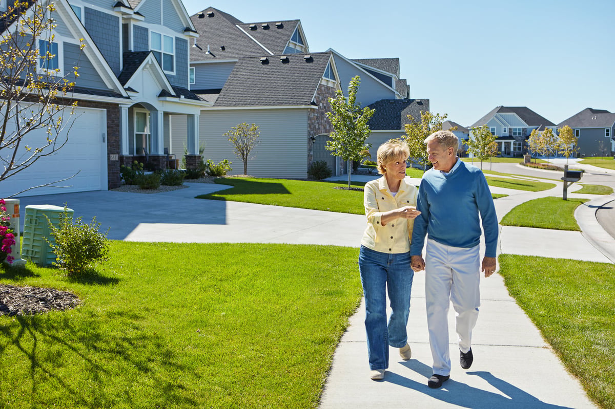 A couple walking through their Central Florida neighborhood